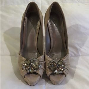 Gold stiletto heels with jewel detail